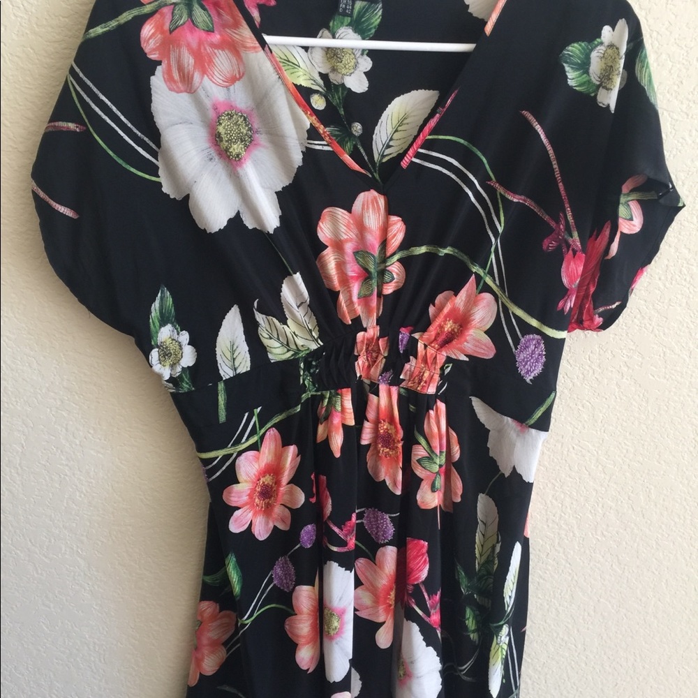 Black base with colorful flowery print on dress